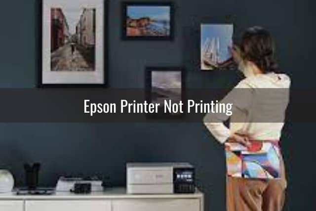 Woman standing while printer is printing