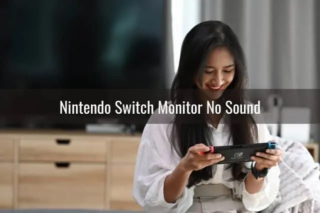 Woman playing Nintendo Switch in living room