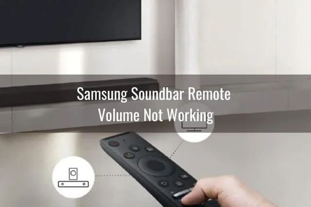 Holding a remote while pointing in the soundbar