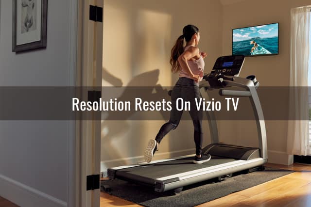 Woman watching tv while having and excercise