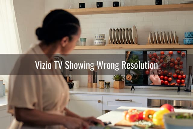 Woman cooking while watching tv