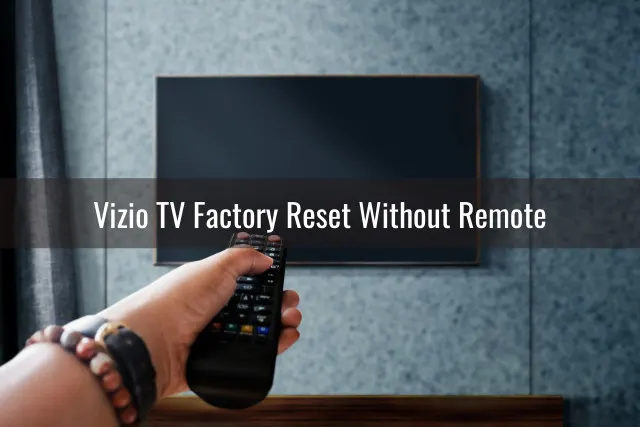 holding a remote while pointing at the TV