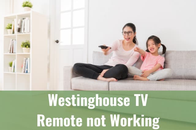 Mother and daughter watching tv while holding a remote