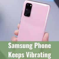 Holding a pink samsung phone