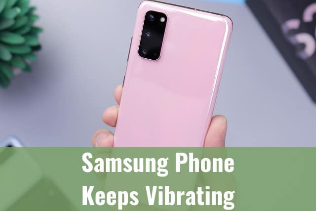 Holding a pink samsung phone