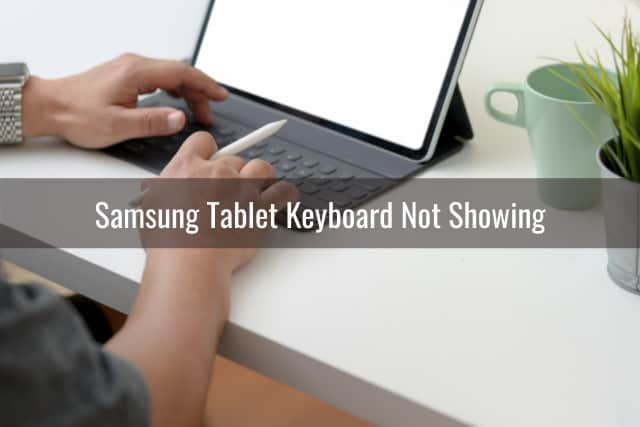 Man typing in the tablet keyboard