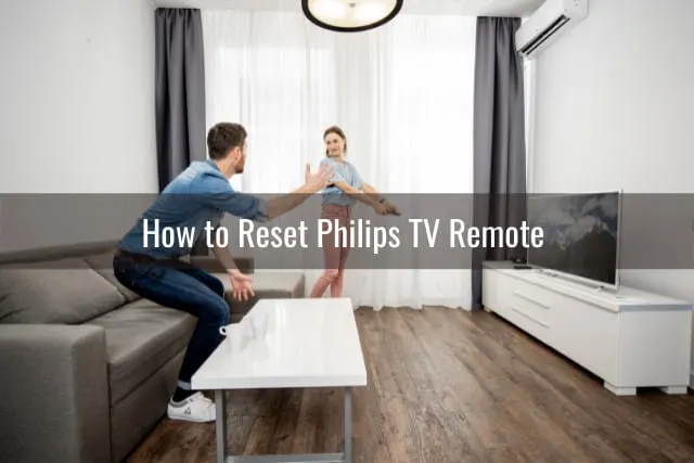 couple holding a remote