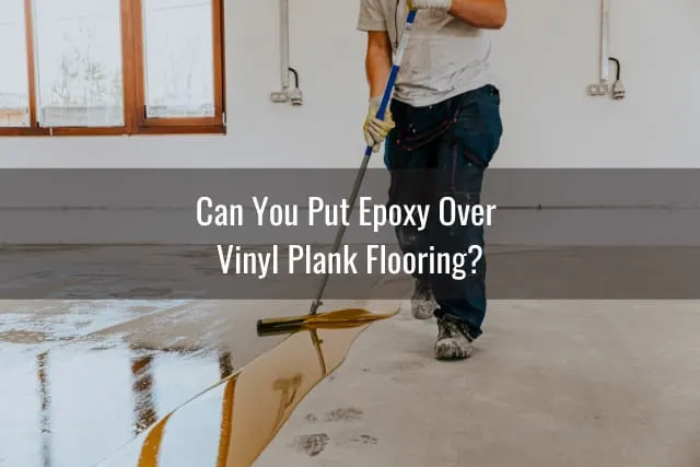 Man putting epoxy on the floor