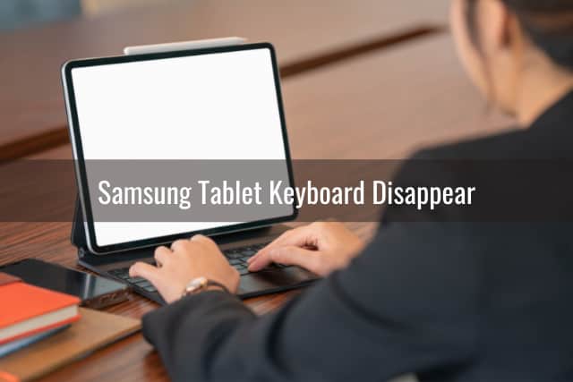 Man typing in the tablet keyboard