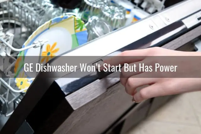 Pressing the on button of dishwasher