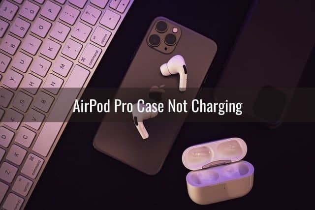 Airpods and case on top of iPhone