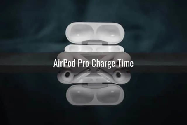 Open AirPod case with AirPod headphones in black background