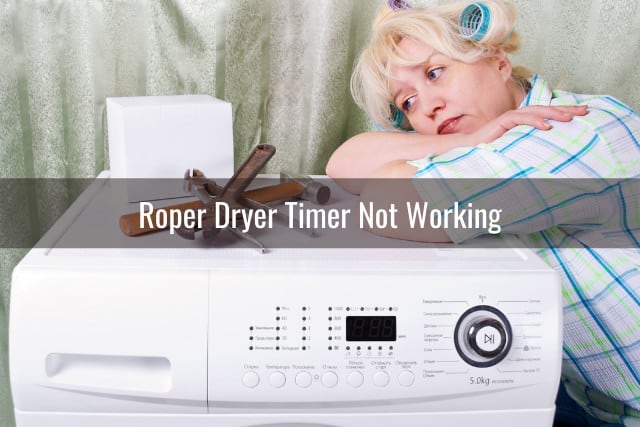 Confused woman while laying on the dryer