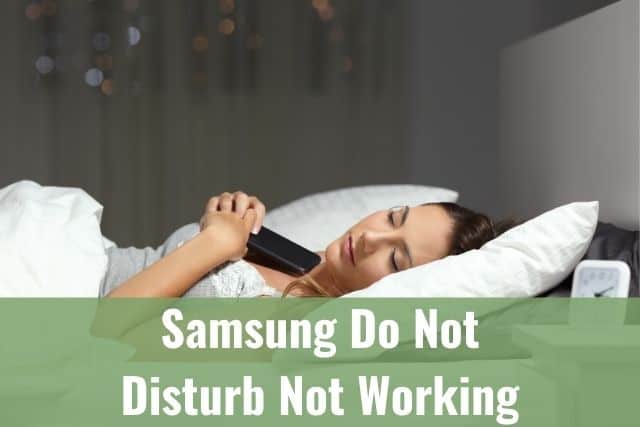 Holding phone while asleep on bed