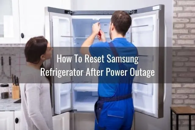Repair man fixing refrigerator