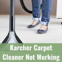 Woman cleaning the carpet using Karcher