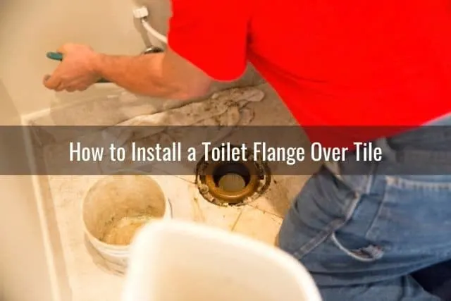 Plumber installing toilet bowel into tile floor