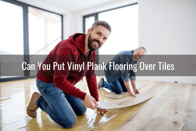 Two man putting vinyl plank flooring