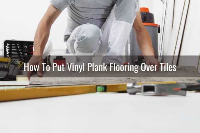 man putting vinyl plank flooring