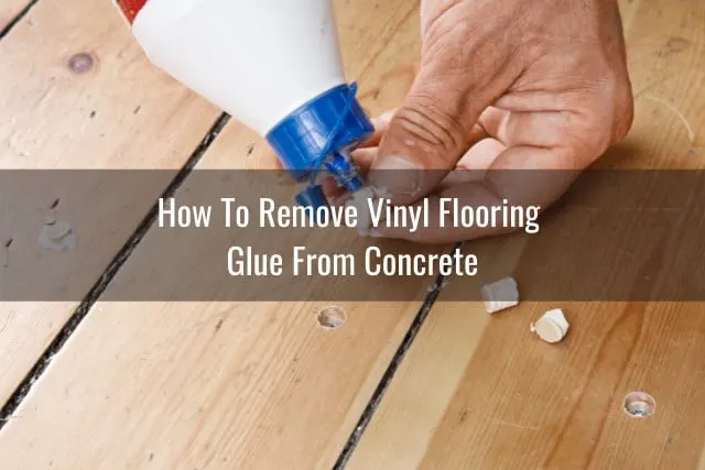 Man removing glue on the floor