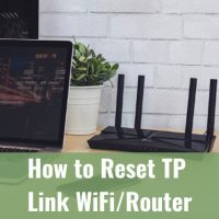 Black router on the tdesk with laptop