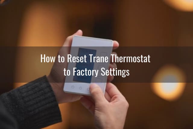 Holding white thermostat