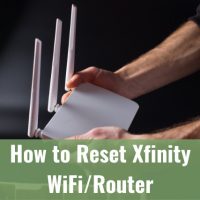 Man holding a white wifi router