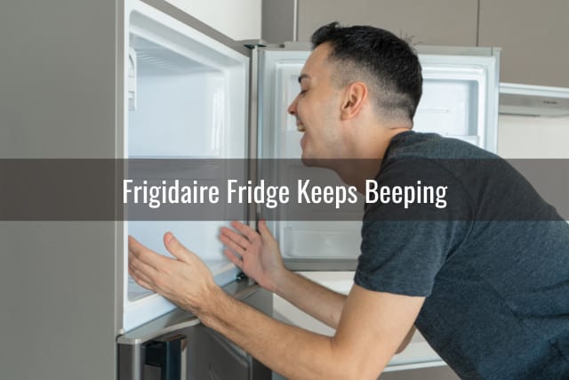 man looking at the refrigerator