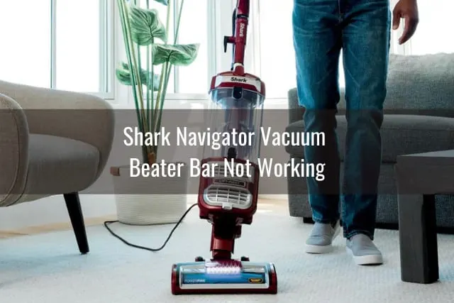 Woman cleaning the carpet using vacuum