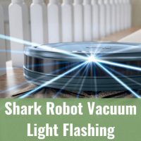 Black vacuum light flashing while cleaning the floor