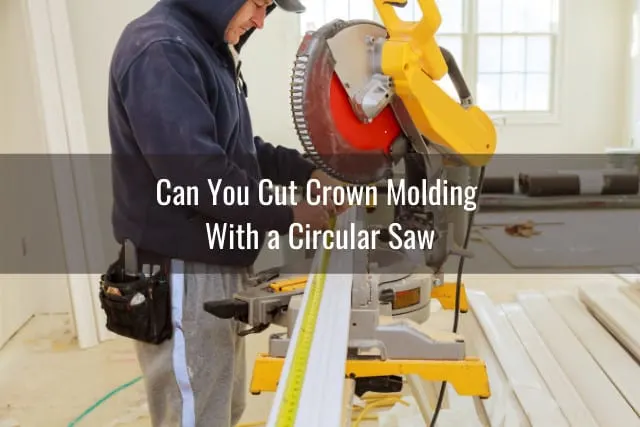Man cutting the crown molding