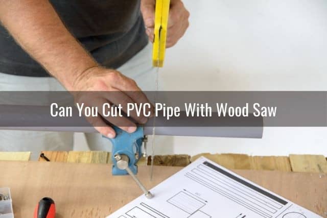 Wood saw cutting PVC pipe