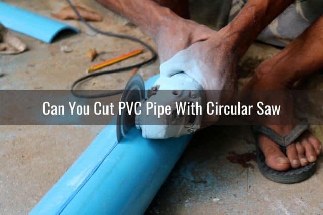 Circular saw cutting blue PVC pipe