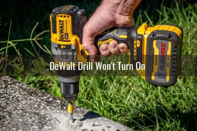 Man using drill in the ground