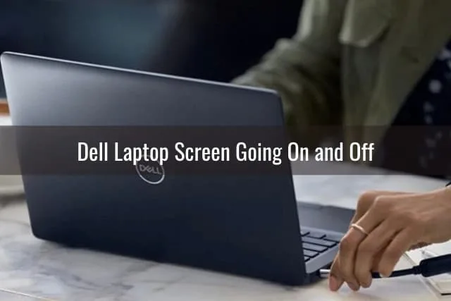 Woman using dell laptop while typing