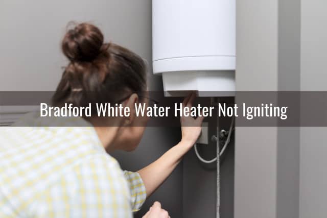 Woman adjusting water heater