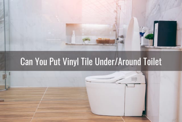 White toilet with vinyl tile