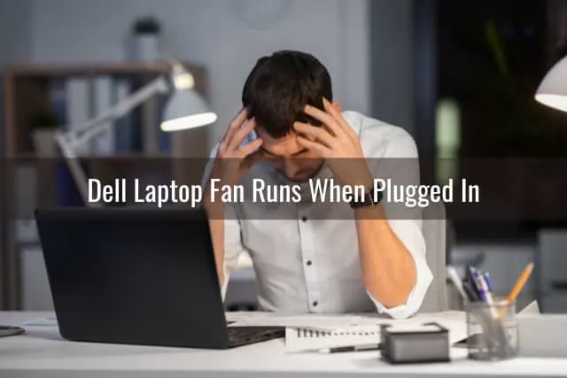 Confused man looking at his laptop