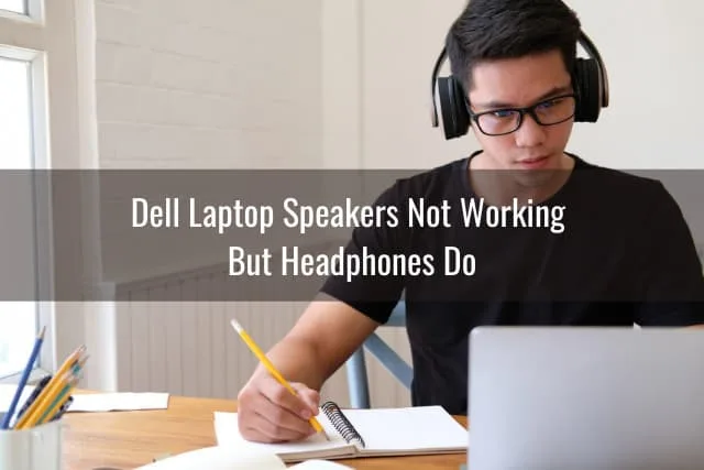 Man using laptop and headphone