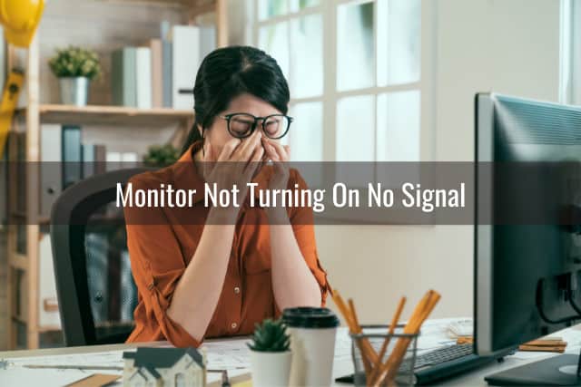 Frustrated woman looking at her monitor