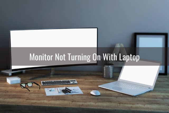 Black Monitor and laptop on the desk
