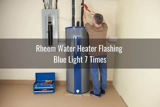 Man making adjustments on his home water heater