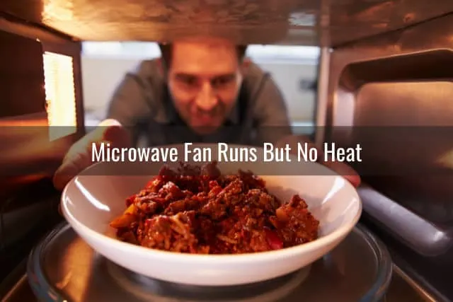 Man putting food inside the microwave