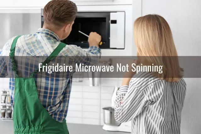 Man Fixing the microwave