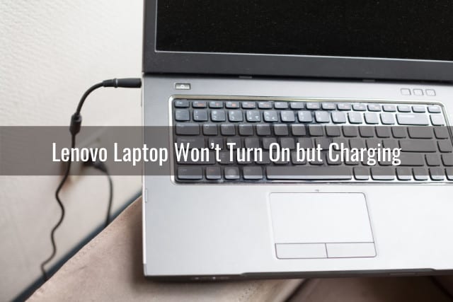 Silver laptop while charging