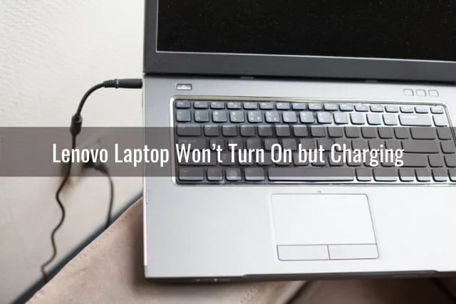 Silver laptop while charging