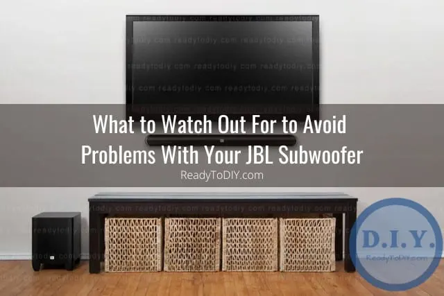 Black subwoofer below the flatscreen tv
