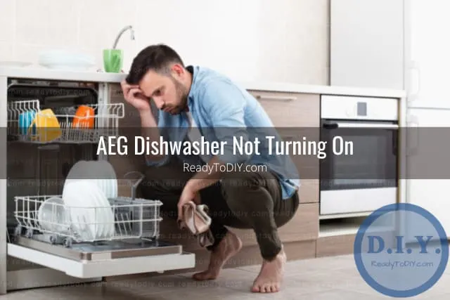 frustrated man looking at the dishwasher