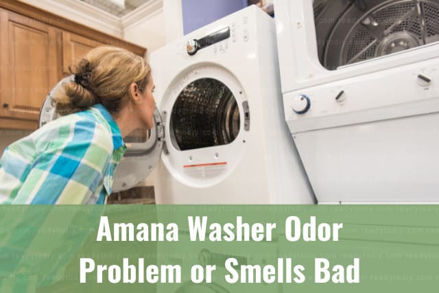 Woman looking at the inside of the washer