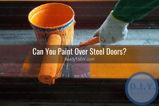 Painting the steel door using paint roll